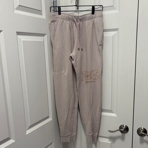 Nike Sweatpants in Soft Beige with Gold Logo